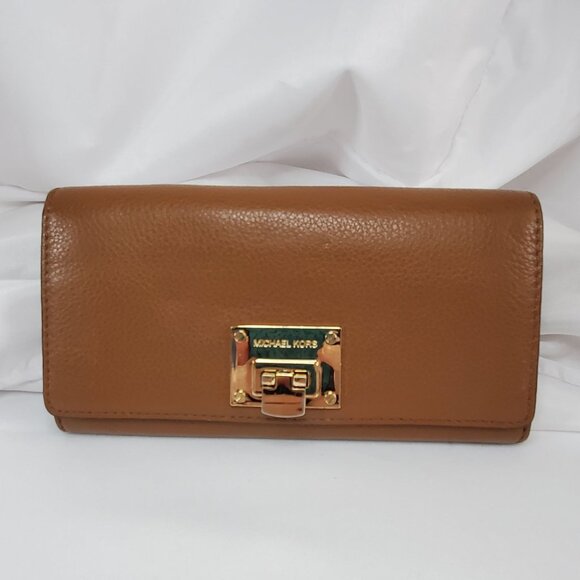 Michael Kors Handbags - Michael Kors Astrid Carryall Wallet Tan Leather With Gold-Tone Lock Closure